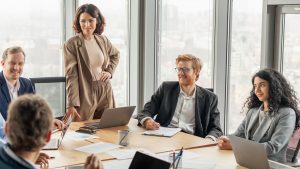 A team of professionals in a business meeting, symbolising transparency and corporate governance.